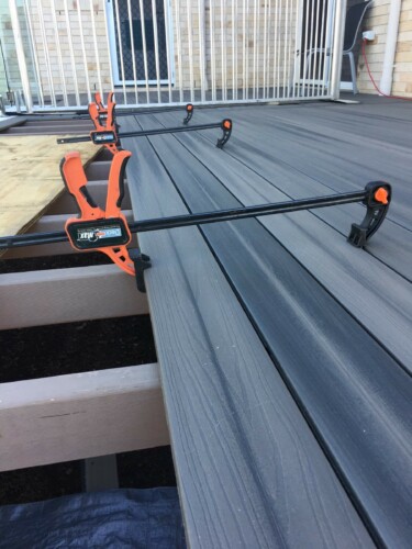 Hidden decking system building with decking clamps